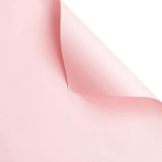 Soft pink folded paper or fabric against a white background