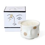 White face-shaped candle in a decorative box