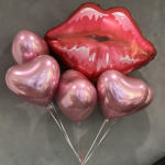 Pink heart balloons and a red lips balloon on a gray background.