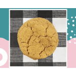 Single cracked cookie on a black-and-white checkered napkin