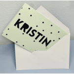 Mint polka-dot card in a white envelope with the name KRISTIN