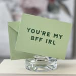 Green greeting card in a glass holder with a matching envelope
