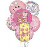 Cluster of pink baby girl balloons with a smiley face and text