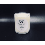 White soy wax candle in a clear glass jar with a printed label