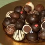 Assorted chocolate truffles in a round box