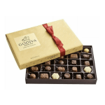 Gold Godiva chocolate gift box with red ribbon and assorted chocolates inside