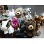 Assorted plush animal toys arranged together on a counter