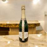 Bottle of Chandon brut sparkling wine on a marble counter