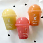 Three colorful plastic cups with dome lids on a white background