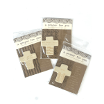 Three packaged cross magnets with prayer cards on a white background
