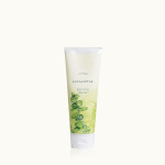 Tube of eucalyptus body scrub with green botanical artwork
