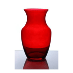 Red glass vase on a reflective surface