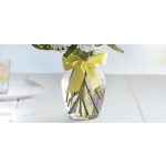 Bouquet in a clear vase tied with a yellow ribbon
