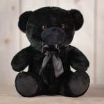 Black teddy bear with a satin ribbon bow