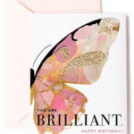 Birthday card with large pink and gold butterfly illustration and text saying You Are Brilliant.