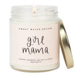 Glass jar candle labeled "girl mama" with a gold lid