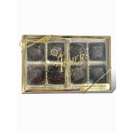 Box of dark chocolate sea salt caramels with gold ribbon