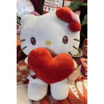 Hello Kitty plush holding a red heart, surrounded by Valentine cards