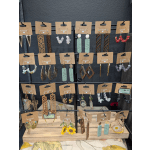 Display rack of handmade earrings on kraft cards