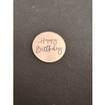 Round pink sticker reading Happy Birthday