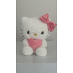 White Hello Kitty plush holding a pink heart with a pink bow