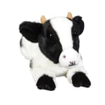 Black-and-white plush cow toy on a white background