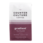 Bag of Counter Culture whole bean coffee with a purple gradient label