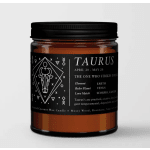 Black-labeled Taurus candle in an amber glass jar