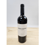 Bottle of Bread & Butter merlot on a wooden surface