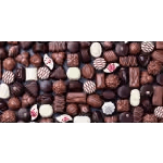 Assorted chocolates in a box with dark and white pieces