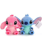 Two Stitch plush toys in pink and blue sitting side by side