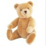 A tan teddy bear sitting upright on a white background