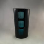 Black tumbler with three teal square accents