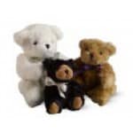 Three teddy bears in white, black, and brown