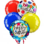 Cluster of colorful birthday balloons with printed messages