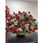 Large bouquet of red roses with white baby's breath in a basket