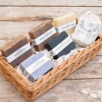 Basket of assorted handmade soap bars and a drawstring pouch
