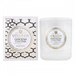 White gardenia-scented candle in a glass jar beside its box