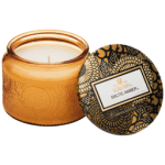 Amber glass candle jar with a patterned lid