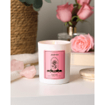 Pink rose scented candle in a white glass jar
