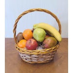 Basket of assorted fruit including bananas, apples, pears, oranges, and kiwi