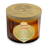 Amber candle in a glass jar with a wooden lid and holiday label