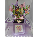Purple gift box with colorful butterfly decorations and a matching card