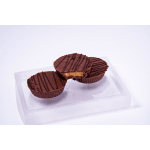 Three chocolate-covered peanut butter cups on a clear box
