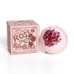 Pink rose bath bomb beside its box