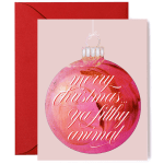Pink Christmas ornament greeting card with white script text and red envelope