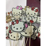 Hello Kitty-themed glitter signs on sticks with hearts and the word Love