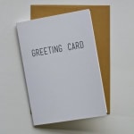 White greeting card on a brown envelope