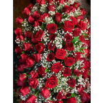 Dense bouquet of red roses with white baby's breath