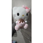 Hello Kitty plush holding a pink frosted donut